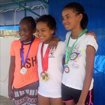 Star swimmers of the Aga Khan Academy Nairobi sprint forward at the International Championships, Dubai